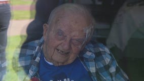 World War II vet celebrates 100th birthday with family through nursing home window