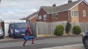 'Friendly neighborhood Spider-Man' entertains children while jogging amid COVID-19 pandemic