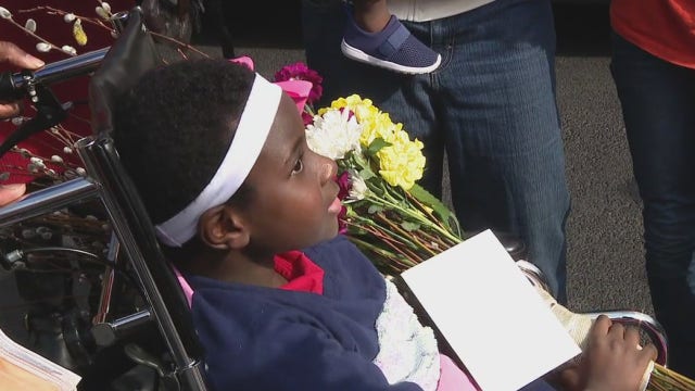 Girl, 8, arrives home from hospital after being struck by car getting off bus