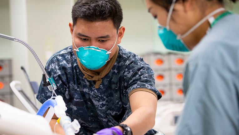 USNS Mercy Sailor Treats Patient