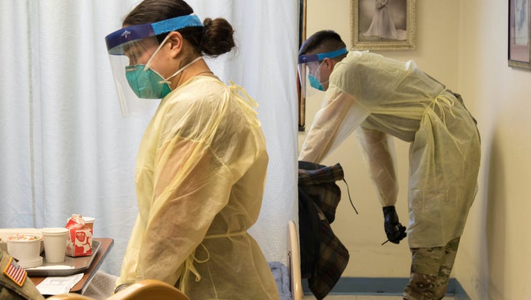 Soldiers from the Massachusetts National Guard provide aid to hospital staff amid the coronavirus pandemic.