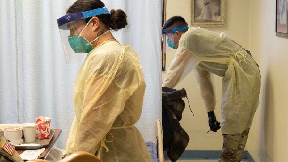 Soldiers from the Massachusetts National Guard provide aid to hospital staff amid the coronavirus pandemic.