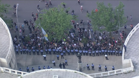 Protesters gather outside Philadelphia police headquarters as citywide looting, riots continue