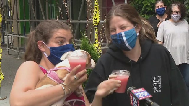 People enjoy cocktails to-go on Memorial Day in Rittenhouse Square