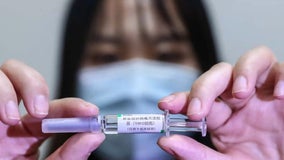 Chinese executives get 'pre-test' injections in vaccine race