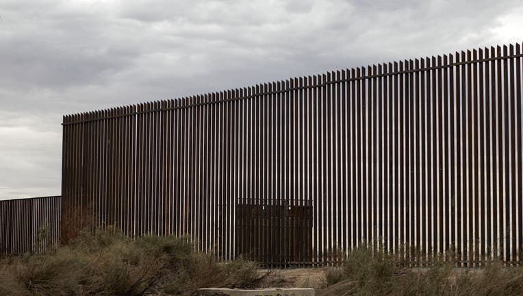 6b845e89-View of a section of the new border fence between Mexico and the US in Mexicali, Baja California state, Mexico on March 10, 2018. President Trump is expected to inspect the border wall prototypes during his visit to California on March 13. / AFP PHOTO / Guillermo Arias (Photo credit should read GUILLERMO ARIAS/AFP via Getty Images)
