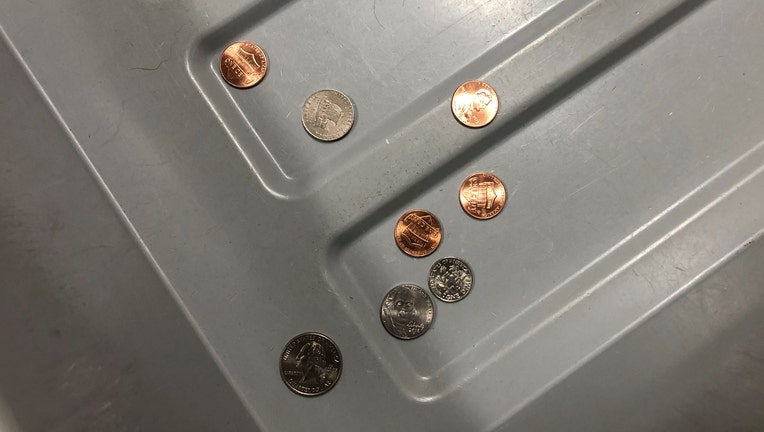 TSA-loose-change-in-bin