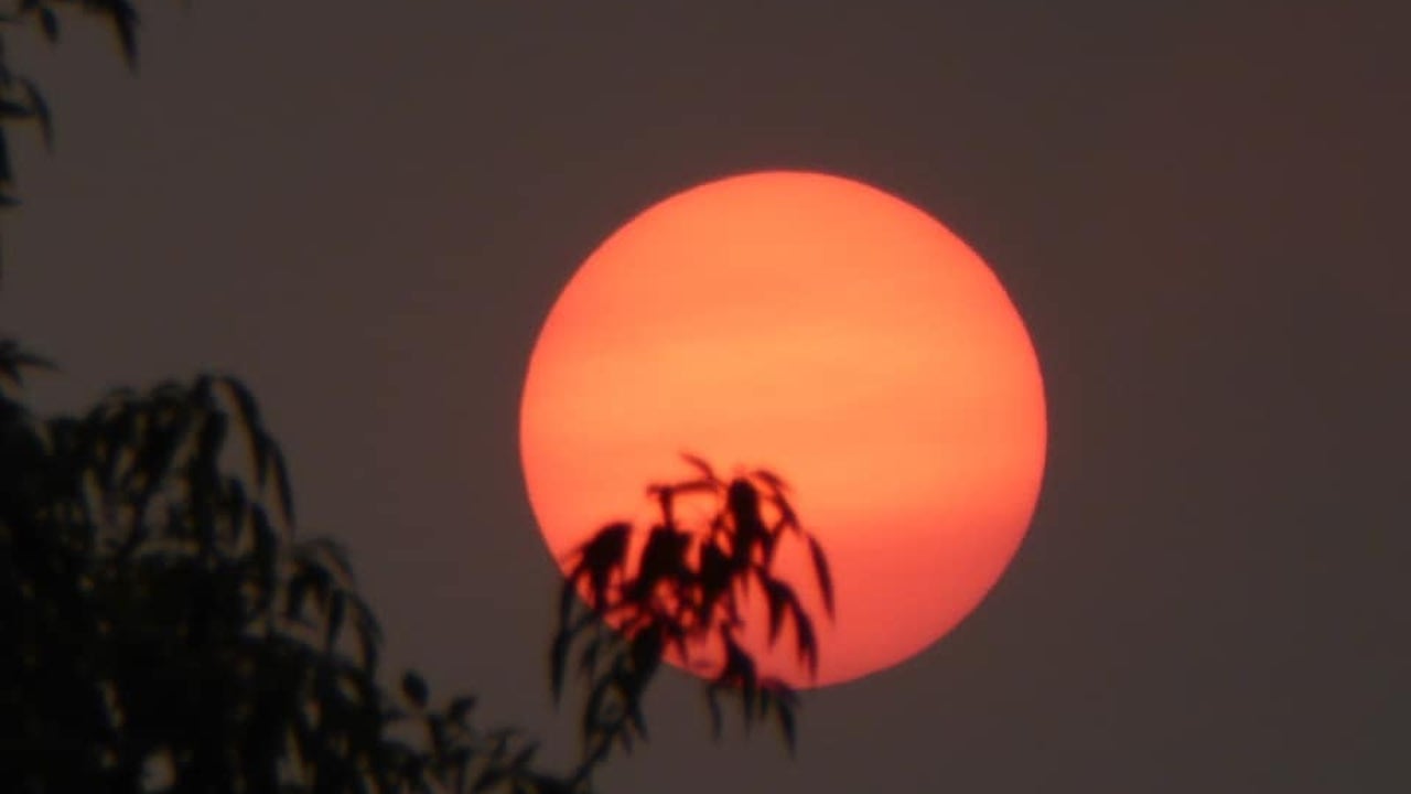 An eerie phenomenon: Wildfires cause sun, moon to glow red in