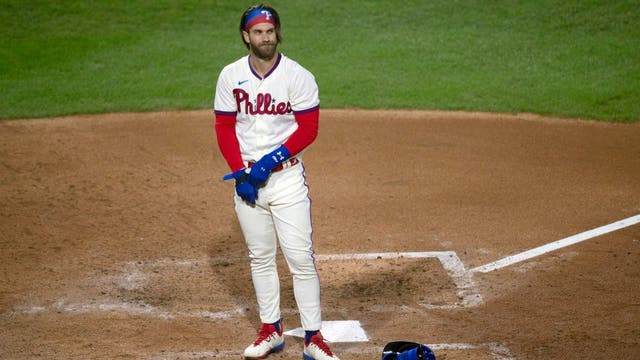 Phillies fail to sweep Blue Jays; Harper has stiff back