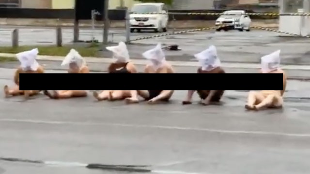 Naked protesters wear 'spit hoods' outside Rochester police building