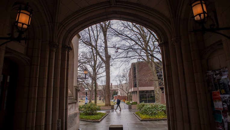 A man walks on campus at Princeton University.