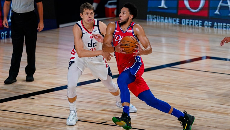 Ben Simmons drives to the basket against the Washington Wizards.