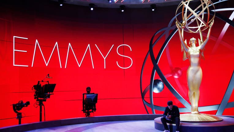 Emmy Host Jimmy Kimmel laughs with stage Manager Gary Natoli during rehearsals Friday for the 72nd Annual Emmy Awards taking place at Staples Center this Sunday.