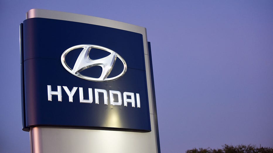 afee0797-A sign is seen at a Hyundai car dealership. Hyundai and Kia