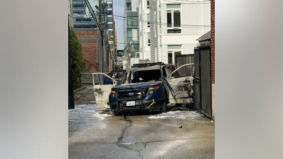 Man arrested after Seattle Police car set on fire with officer inside