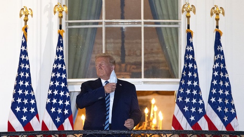 Trump, still infectious, back at White House — without mask