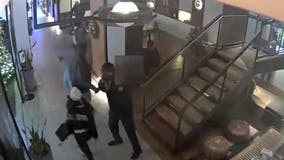 NYPD releases video of woman tackling boy over phone in hotel lobby