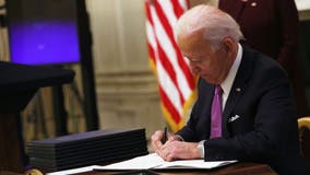 Biden signs executive orders on $15 minimum wage for federal workers, food aid increases