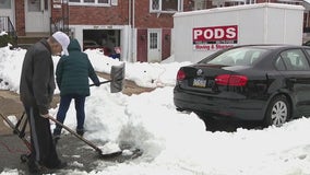 Philadelphia residents struggle to dig out after nor'easter dumps up to a foot of snow