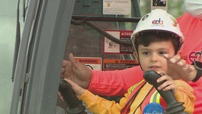 Boy battling cancer becomes construction worker for the day