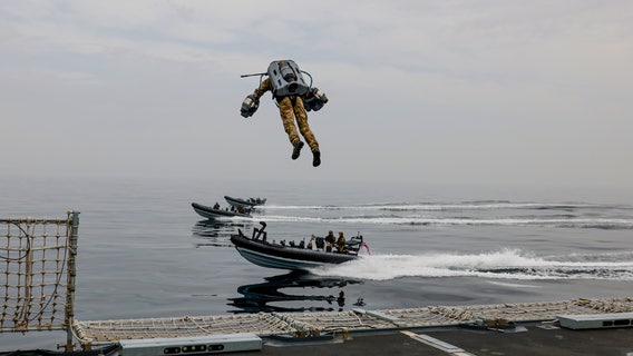 ‘Undoubtedly impressive’: British Marines facilitate jet suit test that allows flight between boats and ships
