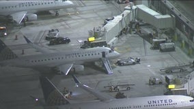 Flight leaving LAX interrupted after passenger opens door, jumps onto taxiway