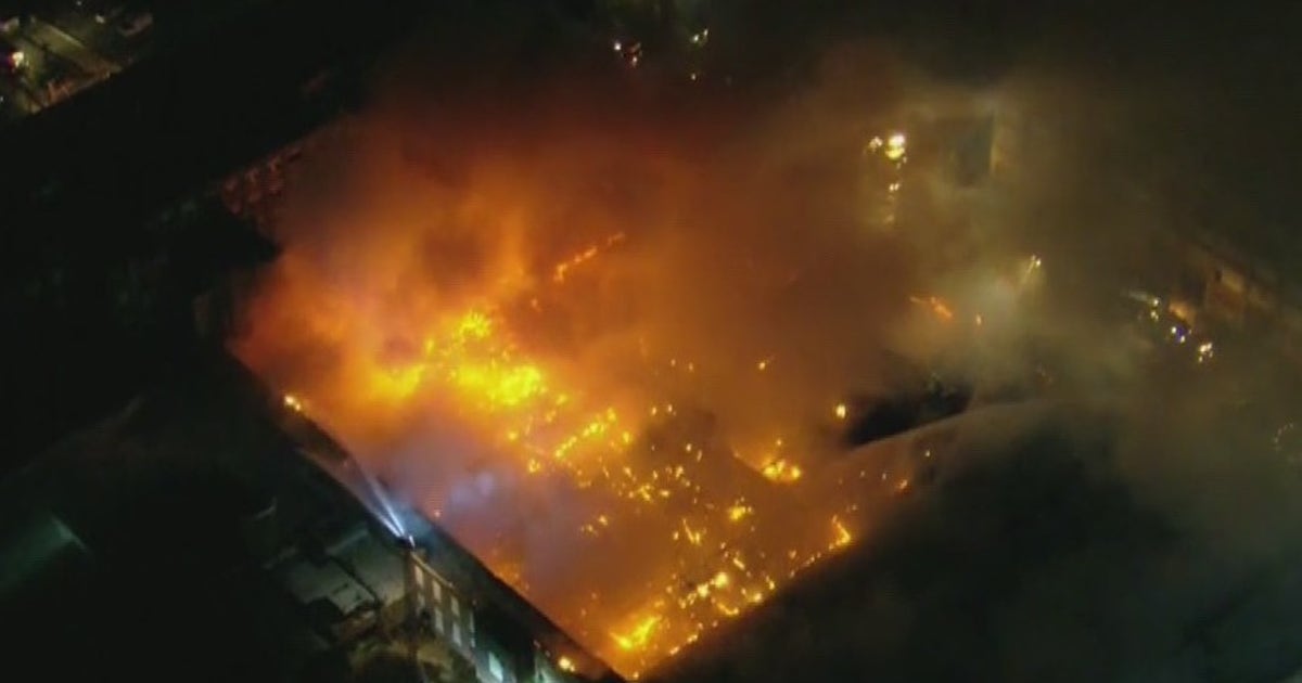 Fire investigators remain on scene of massive warehouse fire in Marcus ...