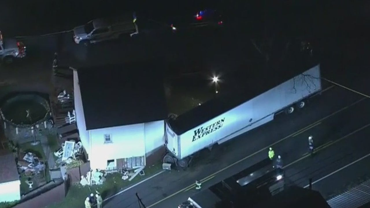 Minor injuries reported after tractor-trailer crashes into house in ...