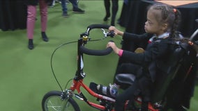 Girl with Down syndrome gets custom adaptive bike donated by non-profit and Philadelphia Flyers organizations