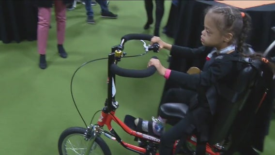 Girl with Down syndrome gets custom adaptive bike donated by non-profit and Philadelphia Flyers organizations