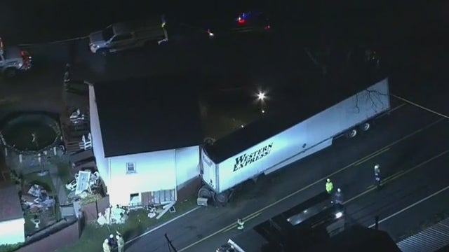 Minor injuries reported after tractor-trailer crashes into house in Berks County