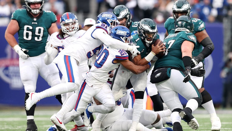 New York Giants safety Julian Love (20) runs up the field during an NFL  football game against the Philadelphia Eagles, Sunday, Nov. 28, 2021, in  East Rutherford, N.J. The New York Giants