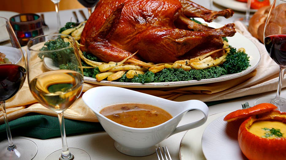 e2ac3216-Saltrubbed, roasted turkey with roasted parsnips, pan sauce, center and spiced pumpkin soup with m