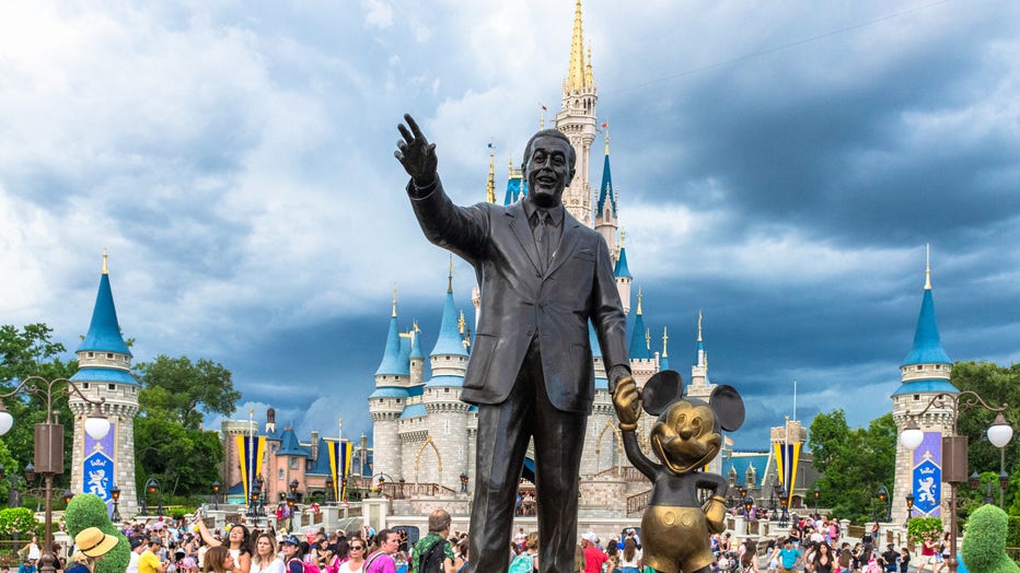 Walt Disney and Mickey Mouse statue inside of the Magic