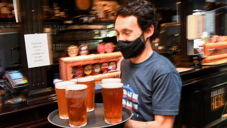 Bartender serving beer