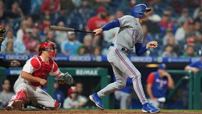 Miller's extra innings hit helps Rangers rally past Phillies, 2-1