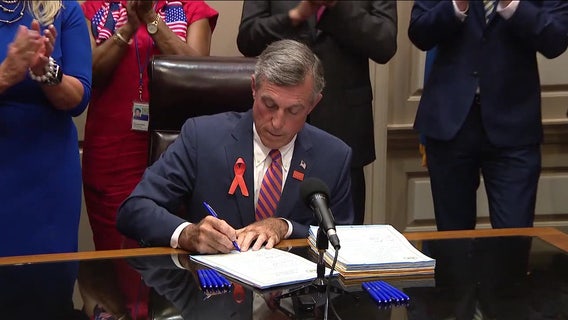 Gov. Carney signs 6 new gun reform bills, including ban on assault weapon sales