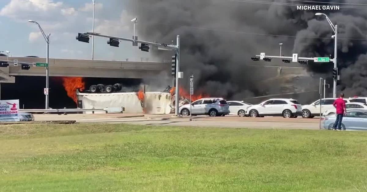 18-wheeler flips over barrier on US-75 overpass in Fairview, driver ...