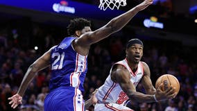 Butler's acrobatic layup, 23 points lead Heat past 76ers