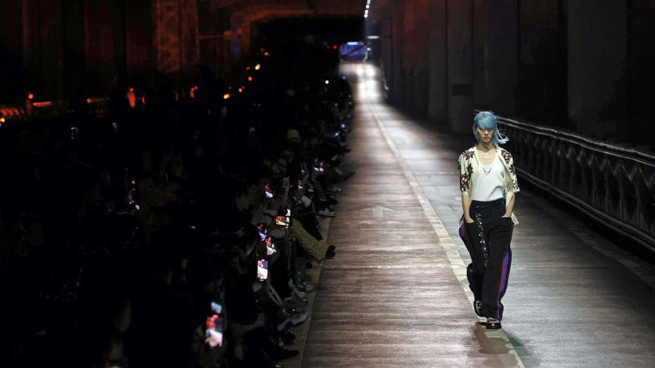 Sora Choi, a fashion model, walks on the runway during the Louis