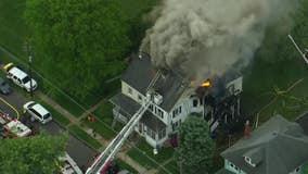 Firefighters extinguish flames in Burlington County house fire, rescue 2 people from roof, officials say