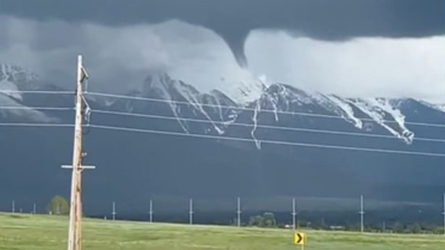 Watch: Rare funnel cloud hovers over Montana mountains