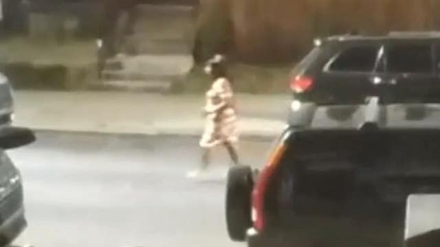 Video: Woman in dress caught stealing gun from car during casual stroll, Philly police say