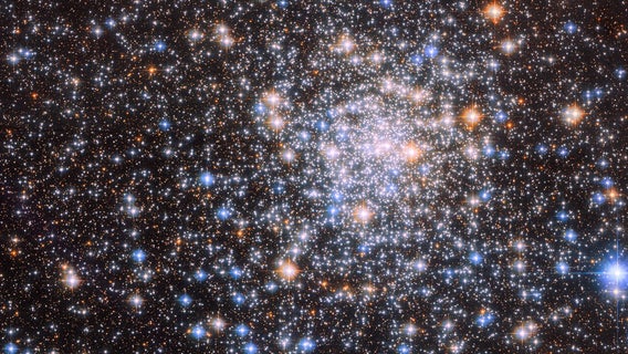‘Glistening’ cluster teeming with stars captured by Hubble telescope