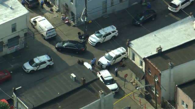 Authorities searching for suspect who shot at police officer in Kensington, officials say