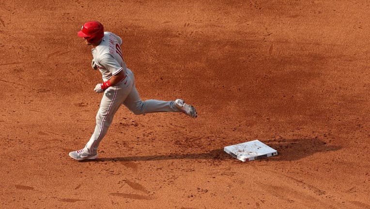 J.T. Realmuto of Team USA reacts to hitting a double in the second