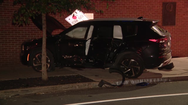 Car crashes into Wyndham Hotel, downs traffic light and sign in Old City