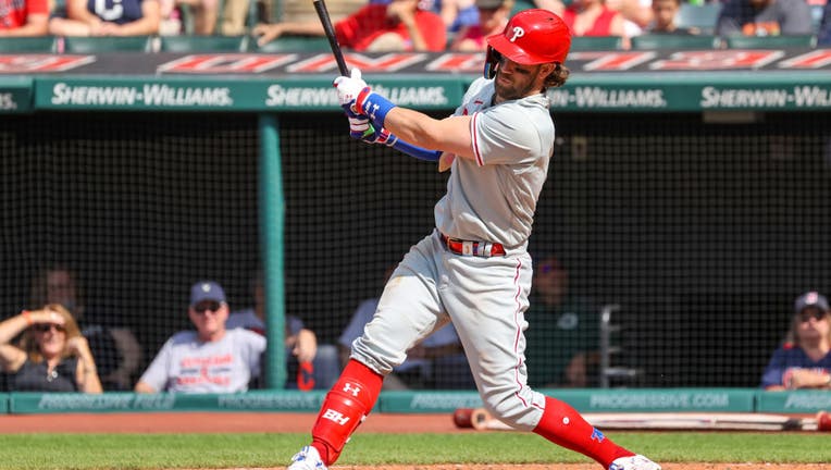 Harper helps Phillies beat Guardians 8-5 in 10 innings