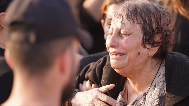 Iraq's prime minister visits victims of wedding fire that killed 100 people