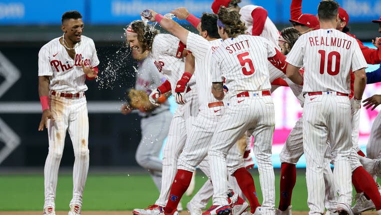 Alec Bohm of the Philadelphia Phillies reacts after hitting a